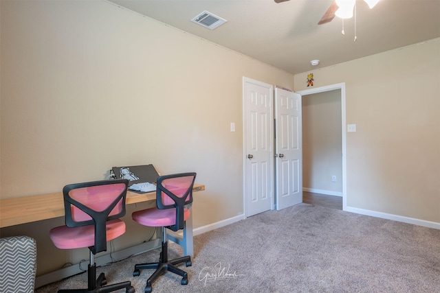 home office featuring a ceiling fan, baseboards, visible vents, and carpet flooring