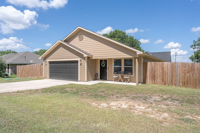 single story home featuring driveway, an attached garage, fence, and a front yard