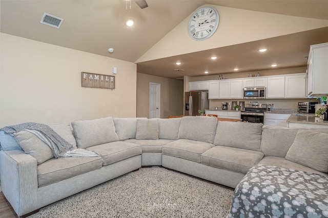 living room with a toaster, visible vents, ceiling fan, high vaulted ceiling, and recessed lighting