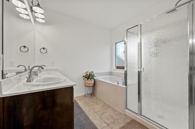 full bathroom with double vanity, a garden tub, tile patterned flooring, a shower stall, and a sink