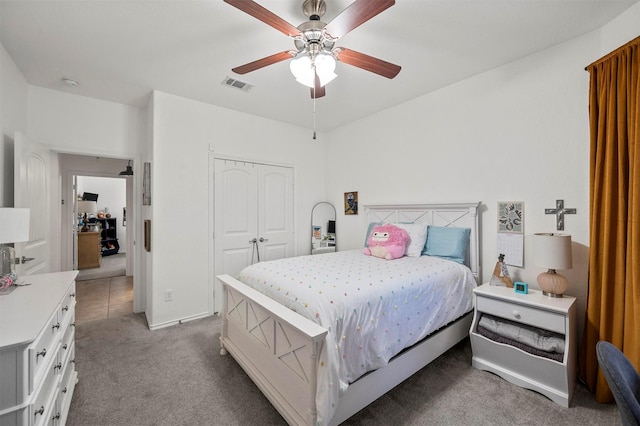 bedroom featuring ceiling fan, a closet, carpet, and visible vents