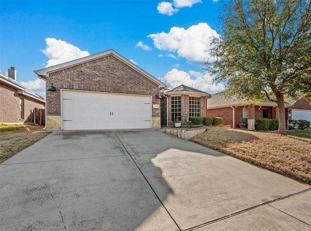 single story home with a garage, concrete driveway, and brick siding