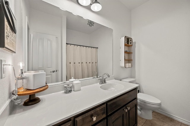 bathroom with toilet, a shower with curtain, vanity, and tile patterned floors