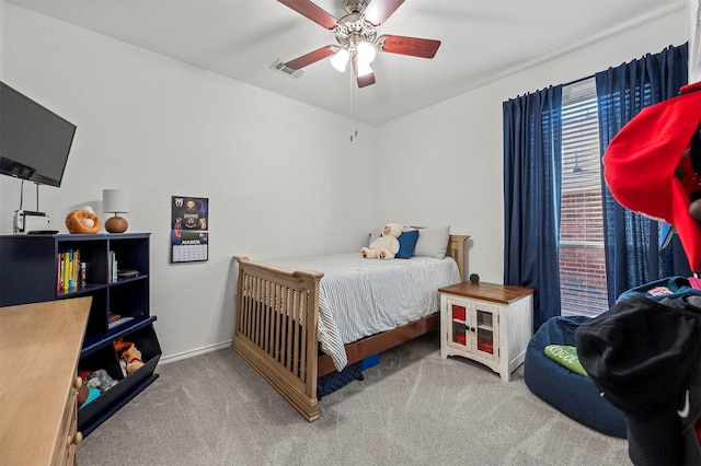 bedroom with carpet, visible vents, ceiling fan, and baseboards