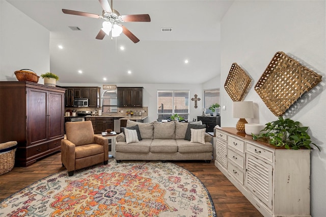 living room featuring a ceiling fan, recessed lighting, visible vents, and dark wood finished floors