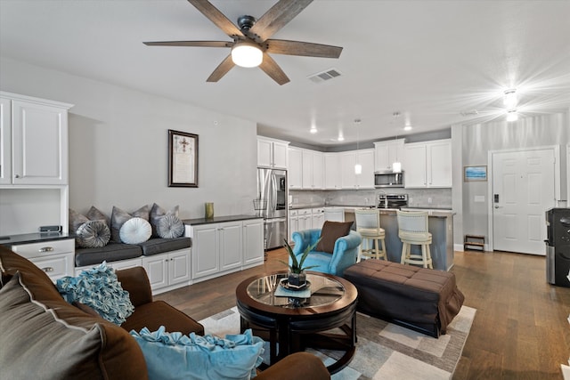 living room featuring visible vents, recessed lighting, ceiling fan, and wood finished floors