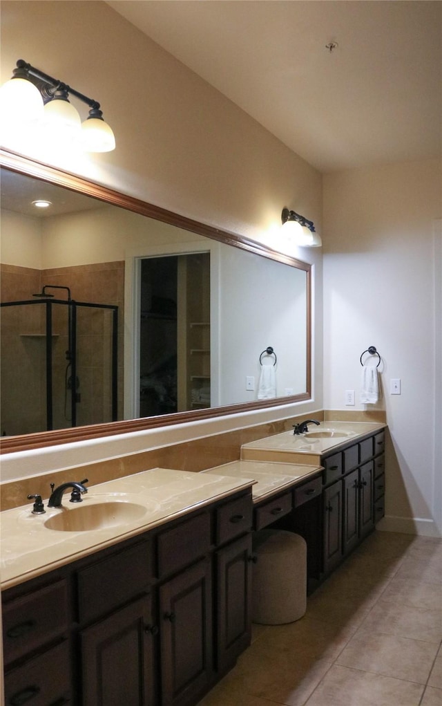 bathroom featuring a shower stall, vanity, and tile patterned floors