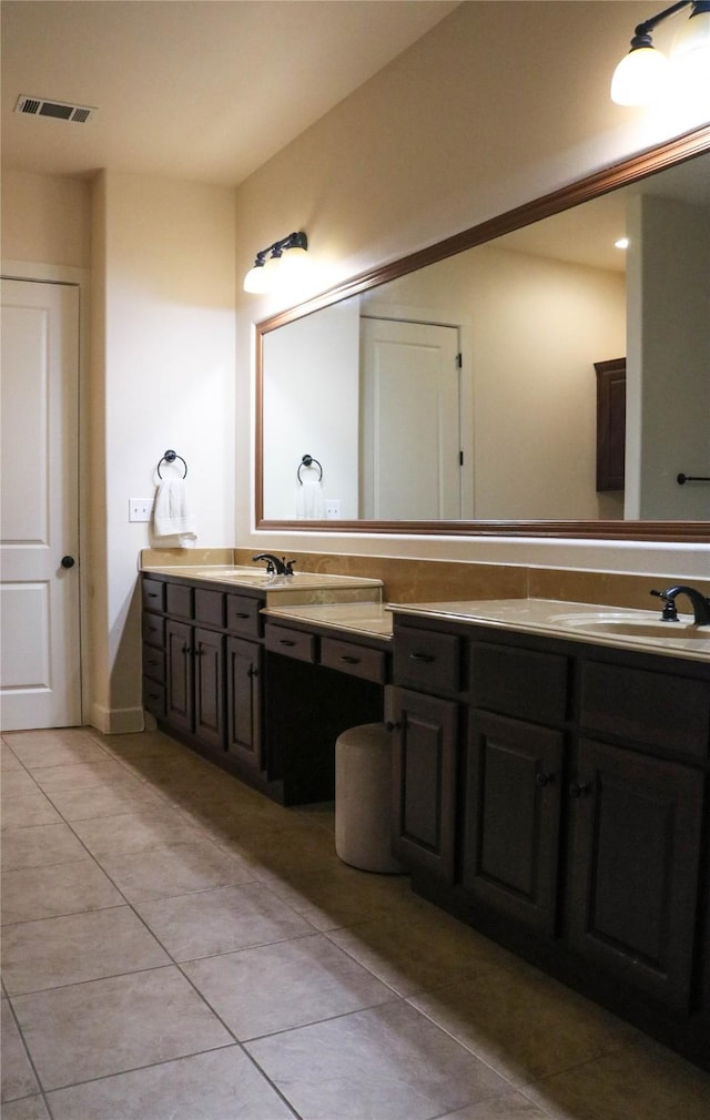 full bath with visible vents, vanity, and tile patterned floors