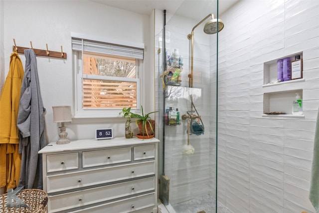 bathroom with a tile shower