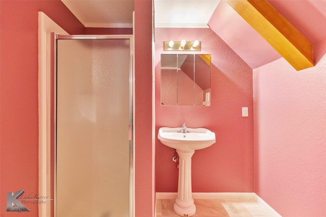 full bathroom with a shower stall, ornamental molding, baseboards, and a textured wall