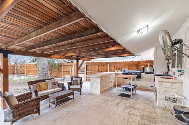 view of patio / terrace with a fenced backyard and an outdoor living space