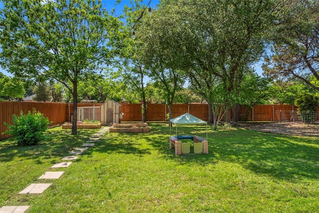 1258 Canterbury Dr, Abilene, TX 79602 - view of yard featuring an outbuilding and a storage unit