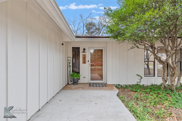 doorway to property with board and batten siding