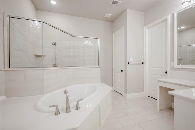 bathroom featuring a bath, tiled shower, visible vents, and tile patterned floors