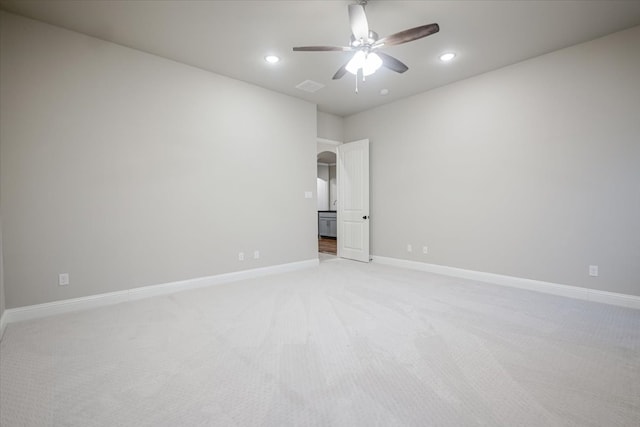 empty room featuring recessed lighting, ceiling fan, baseboards, and light colored carpet