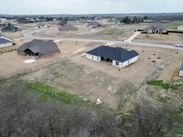 birds eye view of property featuring a rural view