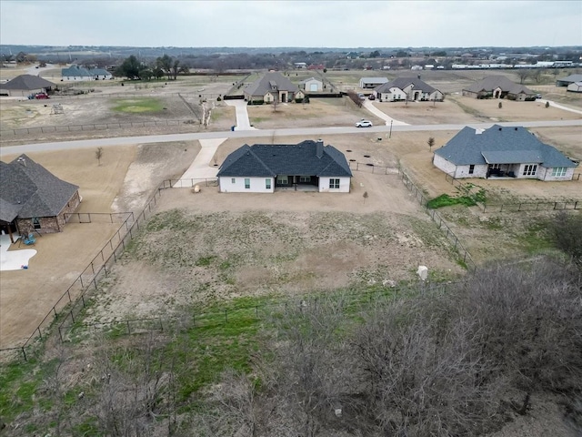 birds eye view of property with a residential view