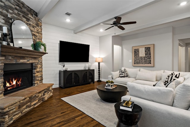 living area featuring visible vents, beamed ceiling, wood finished floors, a fireplace, and recessed lighting