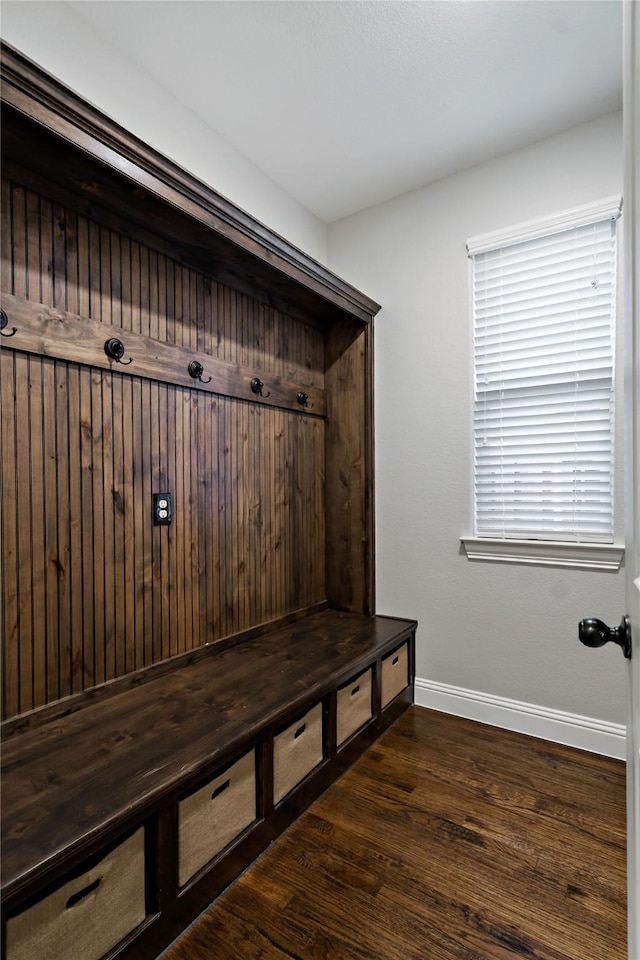 mudroom featuring baseboards and wood finished floors