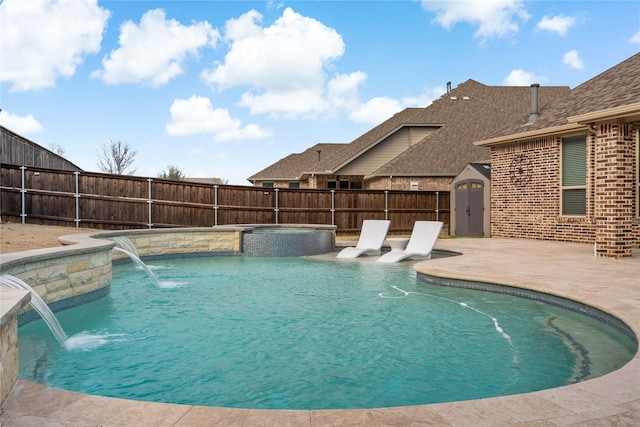 view of swimming pool with a fenced in pool, a fenced backyard, a patio, and an in ground hot tub