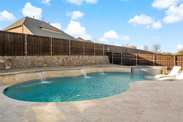 view of swimming pool with a pool with connected hot tub, a fenced backyard, and a patio