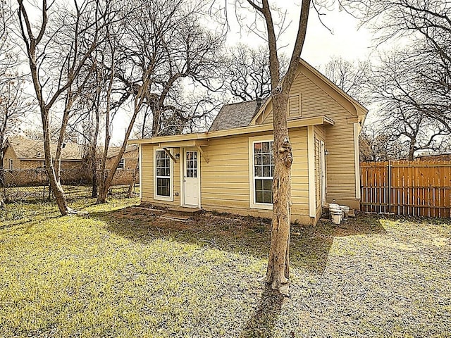 view of outbuilding featuring a fenced backyard