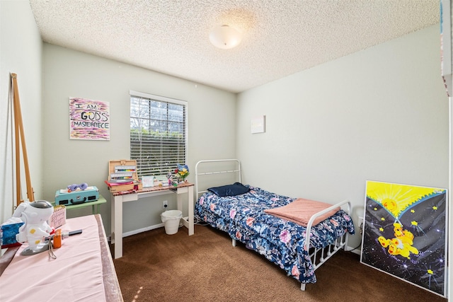 bedroom with a textured ceiling and carpet