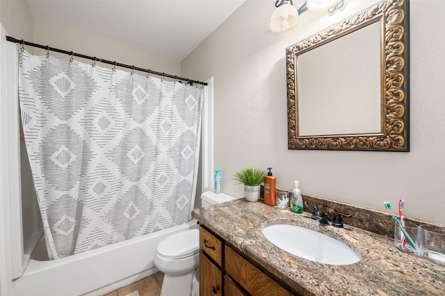 bathroom with shower / bathtub combination with curtain, vanity, and toilet