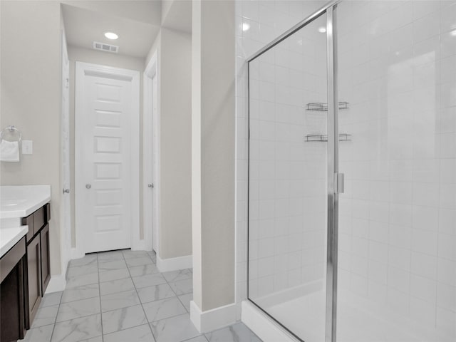 full bathroom with marble finish floor, visible vents, a shower stall, vanity, and baseboards