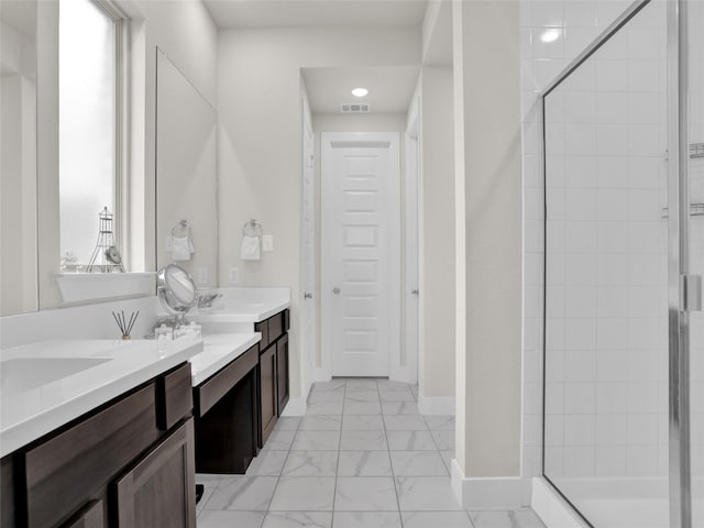 full bath featuring vanity, visible vents, baseboards, marble finish floor, and a stall shower