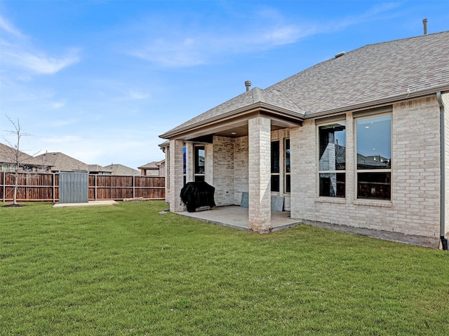 view of yard with fence and a patio