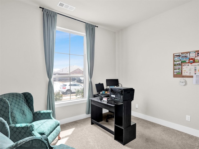 home office with carpet floors, visible vents, and baseboards