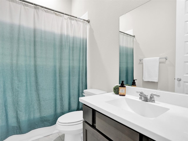 bathroom with tile patterned flooring, vanity, toilet, and a shower with curtain