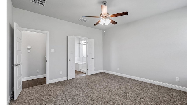 unfurnished bedroom featuring baseboards, visible vents, and carpet flooring