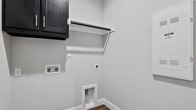 washroom with gas dryer hookup, hookup for an electric dryer, washer hookup, baseboards, and cabinet space