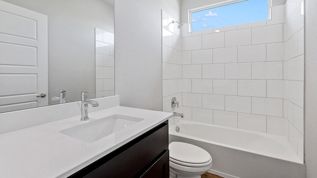 bathroom featuring vanity, toilet, and shower / bathtub combination