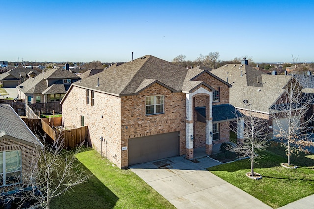 view of front of property with driveway, brick siding, roof with shingles, and a front lawn