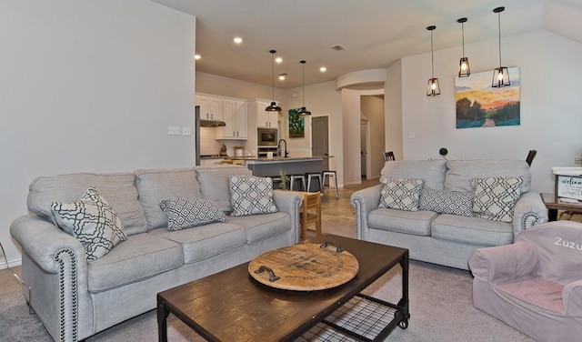 living area with recessed lighting and visible vents