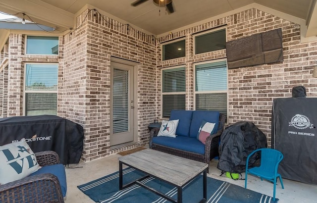 view of patio / terrace featuring grilling area, an outdoor hangout area, and a ceiling fan