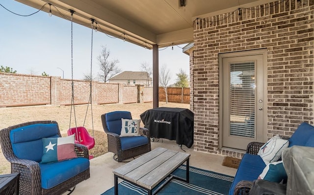 view of patio with a fenced backyard, a grill, and outdoor lounge area