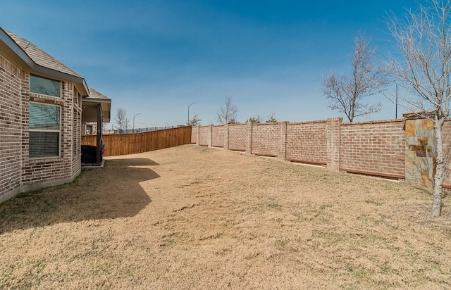 view of yard featuring a fenced backyard