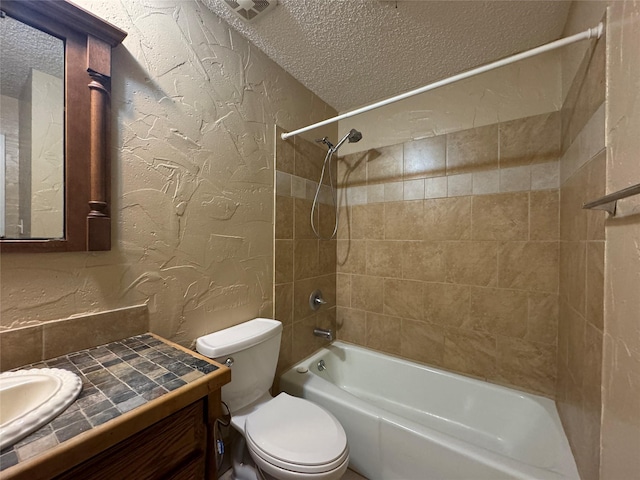 full bath featuring bathing tub / shower combination, a textured wall, toilet, vanity, and a textured ceiling