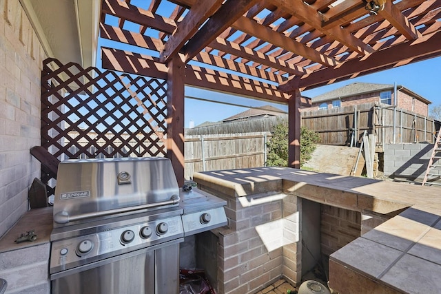 view of patio featuring a fenced backyard, a pergola, grilling area, and area for grilling