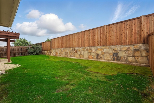 view of yard with a fenced backyard