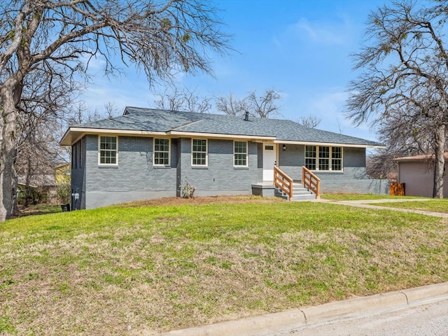 ranch-style home with brick siding and a front lawn