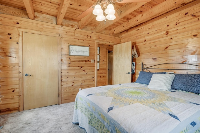 bedroom with carpet, wooden ceiling, beamed ceiling, and wooden walls