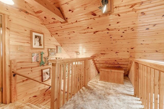 bonus room featuring lofted ceiling, wood walls, wood ceiling, and carpet floors