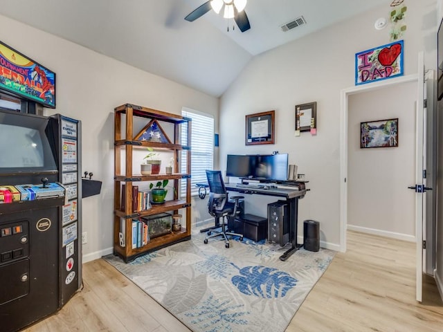 office area with visible vents, vaulted ceiling, a ceiling fan, and wood finished floors