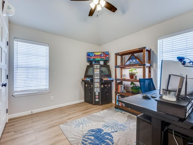 office area with a ceiling fan, baseboards, and wood finished floors