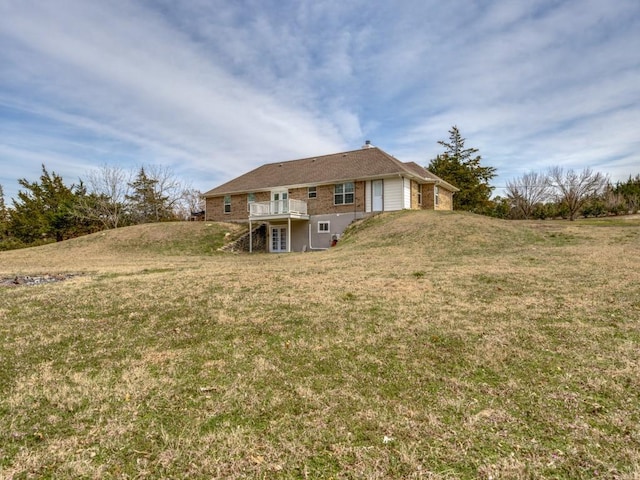 exterior space with a yard and a wooden deck